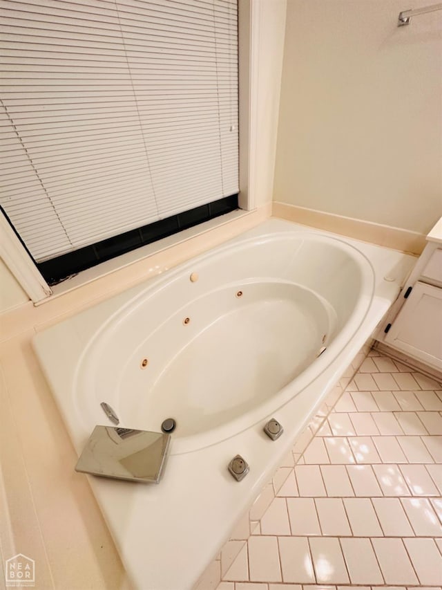 2208 John Cir, Newport, AR 72112 - bathroom with a whirlpool tub and tile patterned flooring