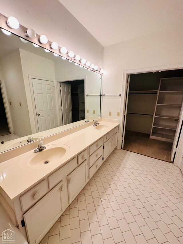 2208 John Cir, Newport, AR 72112 - full bathroom with tile patterned floors, double vanity, and a sink
