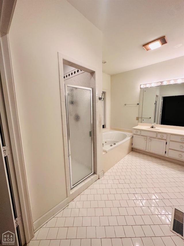 2208 John Cir, Newport, AR 72112 - full bathroom with a garden tub, vanity, tile patterned flooring, visible vents, and a stall shower