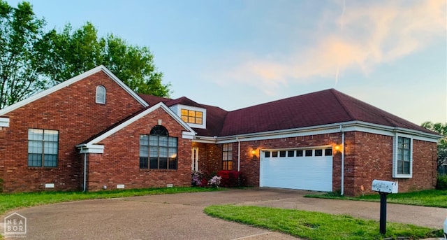 2208 John Cir, Newport, AR 72112 - view of front of house with crawl space, an attached garage, driveway, and brick siding