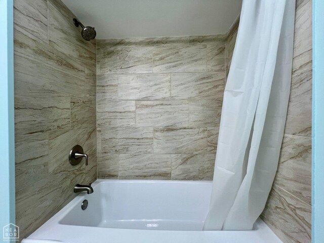 full bathroom featuring shower / bath combo with shower curtain