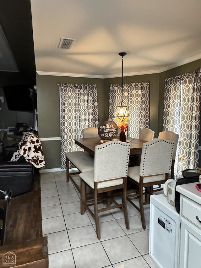 515 6th, Marked Tree, AR 72365 - dining room with ornamental molding and light tile patterned floors