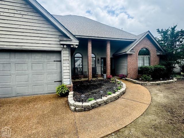 515 6th, Marked Tree, AR 72365 - ranch-style home featuring brick siding, roof with shingles, a garage, and driveway