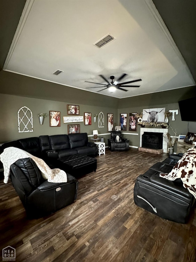 515 6th, Marked Tree, AR 72365 - living room featuring wood finished floors, ceiling fan, and a fireplace
