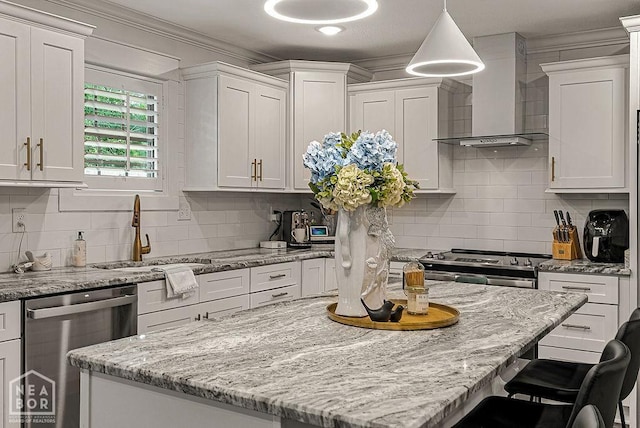 4328 Lynx Ln, Jonesboro, AR 72405 - kitchen featuring stainless steel appliances, wall chimney exhaust hood, white cabinetry, tasteful backsplash, and ornamental molding