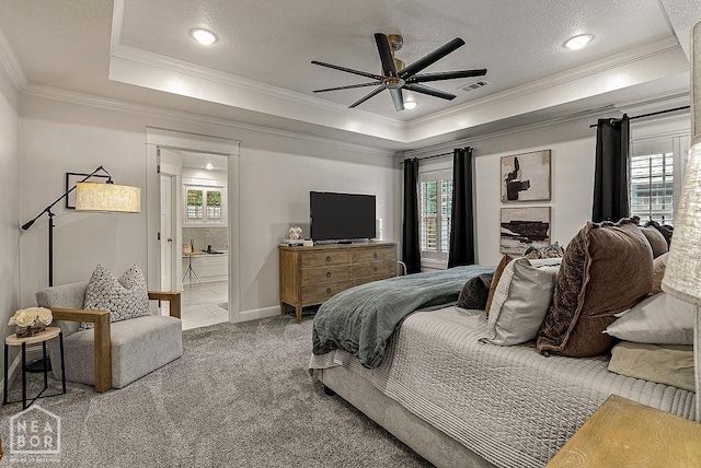 4328 Lynx Ln, Jonesboro, AR 72405 - bedroom featuring carpet flooring, crown molding, a tray ceiling, ensuite bathroom, and a ceiling fan