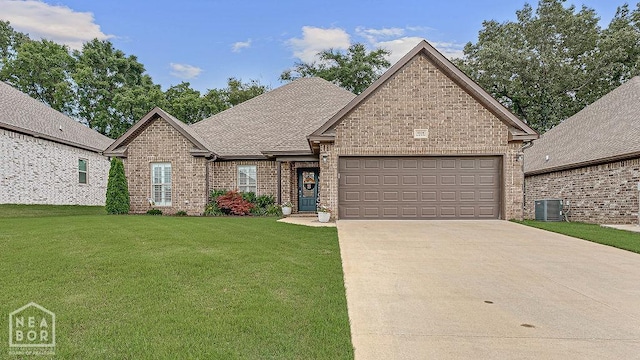 4328 Lynx Ln, Jonesboro, AR 72405 - french country style house with a garage, a front lawn, concrete driveway, brick siding, and a shingled roof