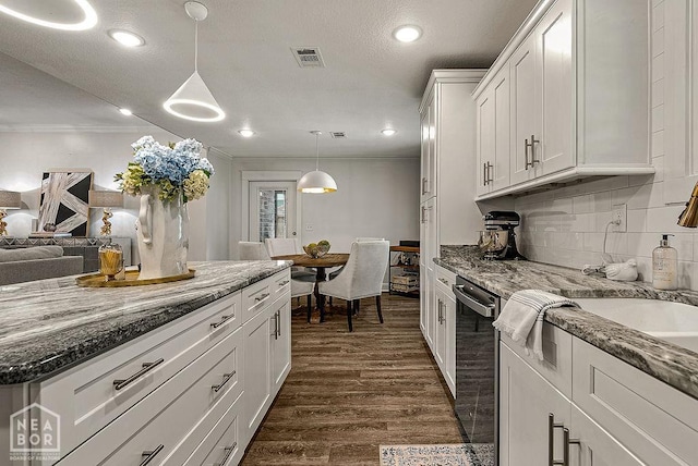 4328 Lynx Ln, Jonesboro, AR 72405 - kitchen with dishwasher, dark wood-style flooring, white cabinetry, backsplash, and light stone countertops