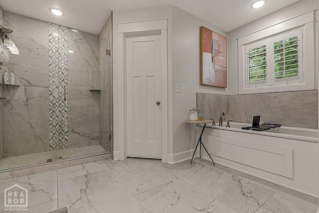 4328 Lynx Ln, Jonesboro, AR 72405 - bathroom featuring marble finish floors, a marble finish shower, a bath, and recessed lighting