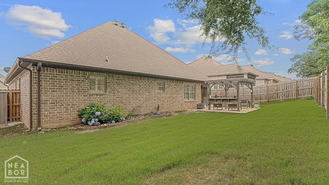 4328 Lynx Ln, Jonesboro, AR 72405 - rear view of house with a pergola, roof with shingles, brick siding, a patio area, and a fenced backyard