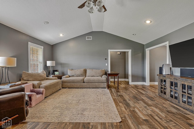5010 S 28th St, Paragould, AR 72450 - living area featuring ceiling fan, vaulted ceiling, dark wood-type flooring, a textured ceiling, and recessed lighting