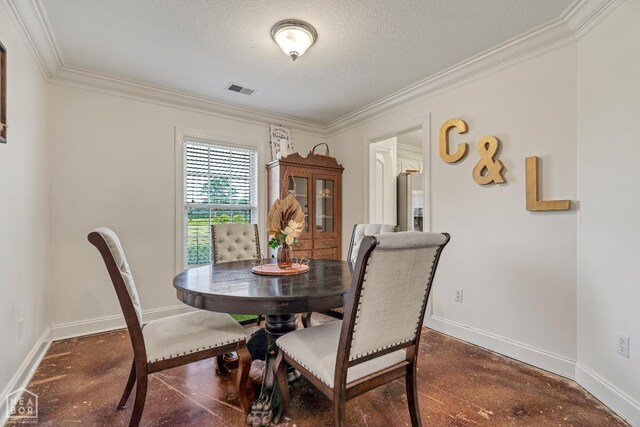 430 County Road 751, Jonesboro, AR 72405 - dining area with ornamental molding, concrete floors, baseboards, and a textured ceiling