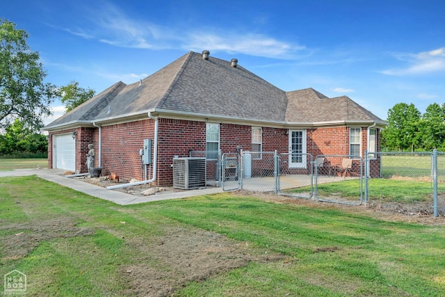 430 County Road 751, Jonesboro, AR 72405 - back of house with brick siding, a garage, roof with shingles, a gate, and central air condition unit