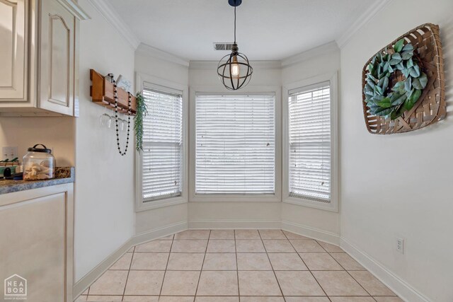 430 County Road 751, Jonesboro, AR 72405 - unfurnished dining area featuring plenty of natural light, light tile patterned floors, crown molding, and baseboards