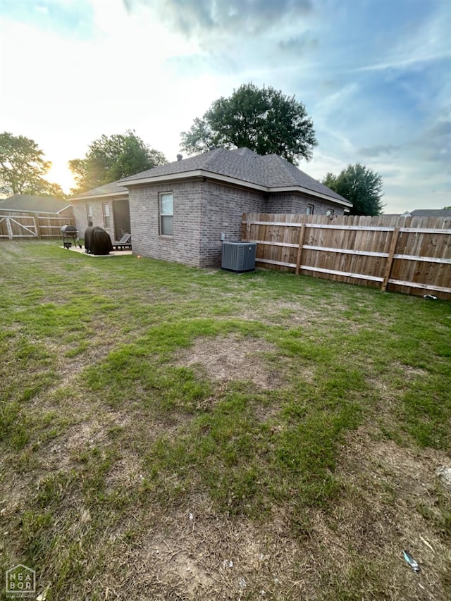 view of yard featuring central AC