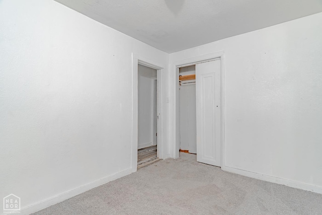 403 N Bridge St, Jonesboro, AR 72401 - unfurnished bedroom with carpet flooring, baseboards, and a closet