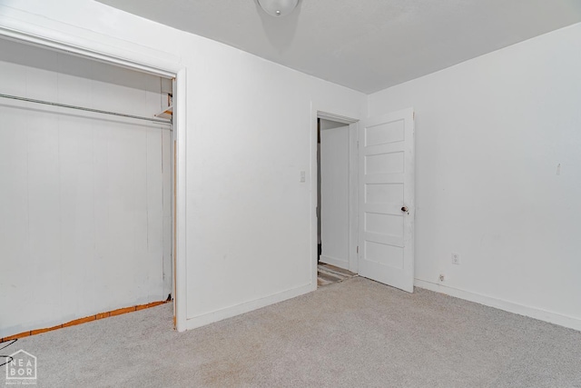 403 N Bridge St, Jonesboro, AR 72401 - unfurnished bedroom featuring carpet flooring, a closet, and baseboards