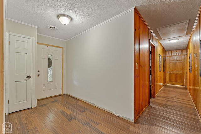 406 E Ash St E, Keiser, AR 72351 - foyer with wood finished floors, a textured ceiling, and ornamental molding