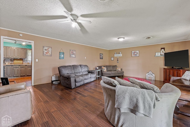 406 E Ash St E, Keiser, AR 72351 - living room featuring a textured ceiling, wood finished floors, ceiling fan, and ornamental molding