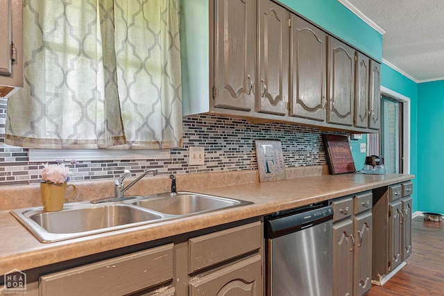 406 E Ash St E, Keiser, AR 72351 - kitchen with stainless steel dishwasher, ornamental molding, a sink, a textured ceiling, and decorative backsplash