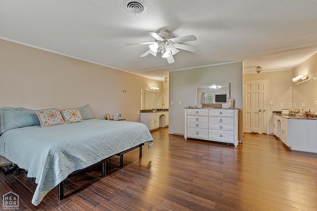 406 E Ash St E, Keiser, AR 72351 - bedroom featuring crown molding, a textured ceiling, dark wood finished floors, a ceiling fan, and ensuite bathroom