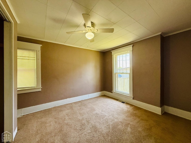 505 N Pruett St N, Paragould, AR 72450 - carpeted spare room featuring ornamental molding and a ceiling fan