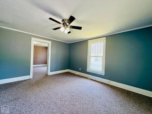 505 N Pruett St N, Paragould, AR 72450 - spare room featuring a ceiling fan, carpet flooring, and ornamental molding