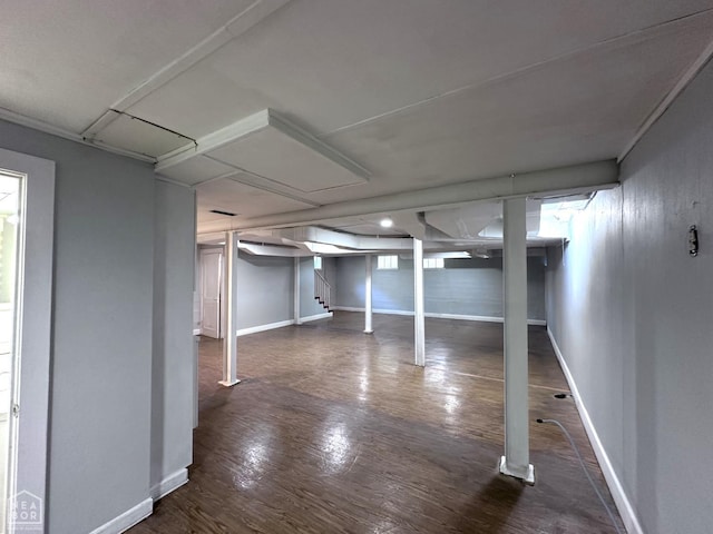 582 N 4th Ave, Piggott, AR 72454 - finished basement featuring dark wood finished floors, baseboards, and stairs