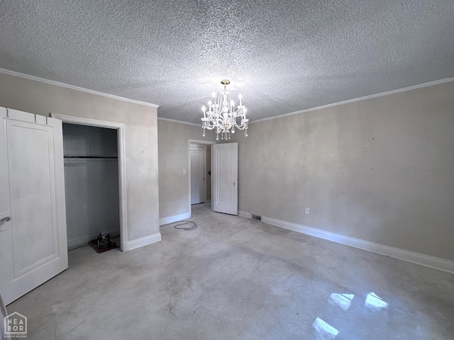 582 N 4th Ave, Piggott, AR 72454 - unfurnished bedroom featuring a chandelier, crown molding, baseboards, a closet, and a textured ceiling