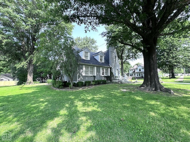 582 N 4th Ave, Piggott, AR 72454 - view of front of property featuring a front lawn and a chimney