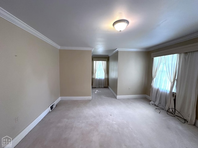 582 N 4th Ave, Piggott, AR 72454 - spare room with crown molding, baseboards, and light carpet