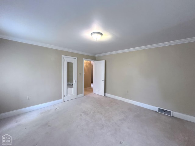582 N 4th Ave, Piggott, AR 72454 - unfurnished bedroom featuring ornamental molding, baseboards, and light carpet