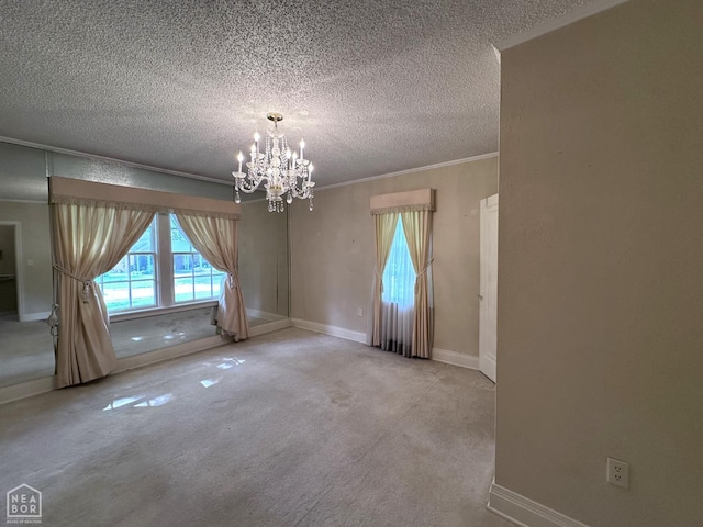 582 N 4th Ave, Piggott, AR 72454 - carpeted spare room featuring a chandelier, a textured ceiling, baseboards, and crown molding