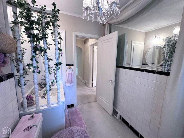 582 N 4th Ave, Piggott, AR 72454 - bathroom featuring concrete flooring, ornamental molding, and a chandelier
