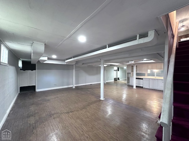 582 N 4th Ave, Piggott, AR 72454 - finished basement featuring baseboards, stairs, dark wood-style flooring, and recessed lighting
