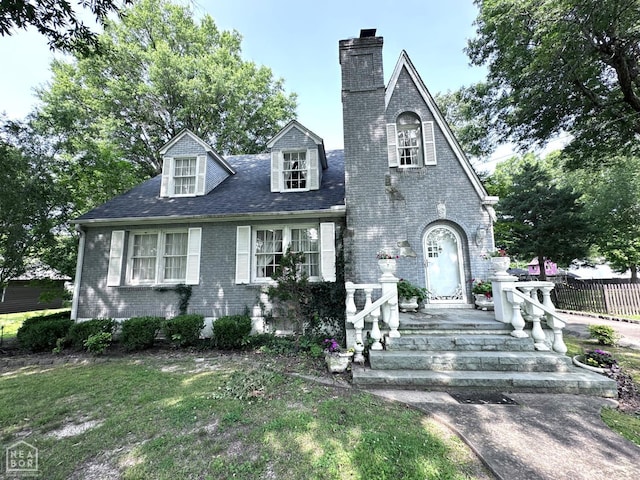 582 N 4th Ave, Piggott, AR 72454 - view of front of home featuring brick siding and a chimney