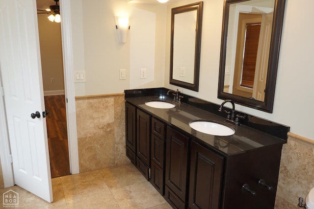1805 Covey Dr, Jonesboro, AR 72404 - full bath featuring double vanity, wainscoting, a ceiling fan, tile patterned flooring, and tile walls