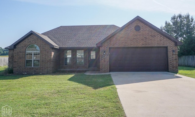 1805 Covey Dr, Jonesboro, AR 72404 - ranch-style house with brick siding, concrete driveway, an attached garage, and a shingled roof