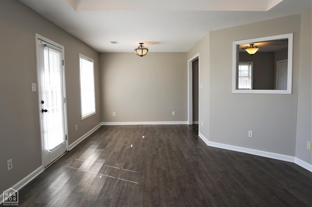 1805 Covey Dr, Jonesboro, AR 72404 - spare room featuring dark wood-style floors