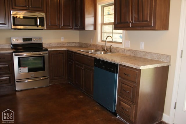 1805 Covey Dr, Jonesboro, AR 72404 - kitchen with stainless steel appliances, light countertops, and dark brown cabinets