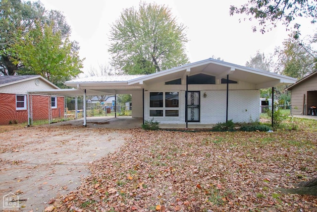 1805 Covey Dr, Jonesboro, AR 72404 - rear view of house with an attached carport and brick siding