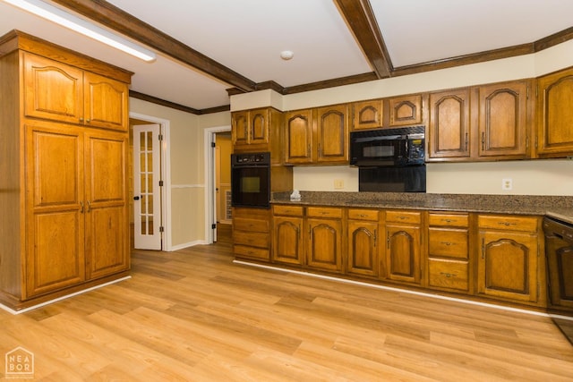 1805 Covey Dr, Jonesboro, AR 72404 - kitchen with black appliances, beamed ceiling, brown cabinetry, light wood-type flooring, and dark stone counters