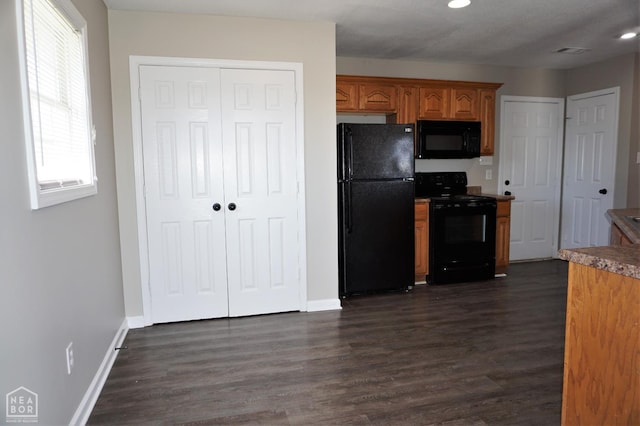 1805 Covey Dr, Jonesboro, AR 72404 - kitchen featuring black appliances, dark wood finished floors, brown cabinetry, and recessed lighting