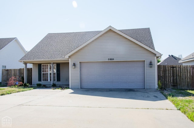 1805 Covey Dr, Jonesboro, AR 72404 - view of front facade with concrete driveway, a shingled roof, and a garage