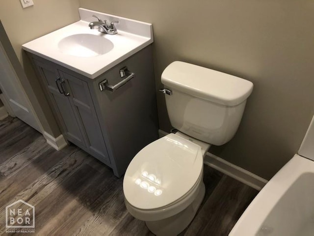 1805 Covey Dr, Jonesboro, AR 72404 - bathroom featuring vanity, wood finished floors, and a bath