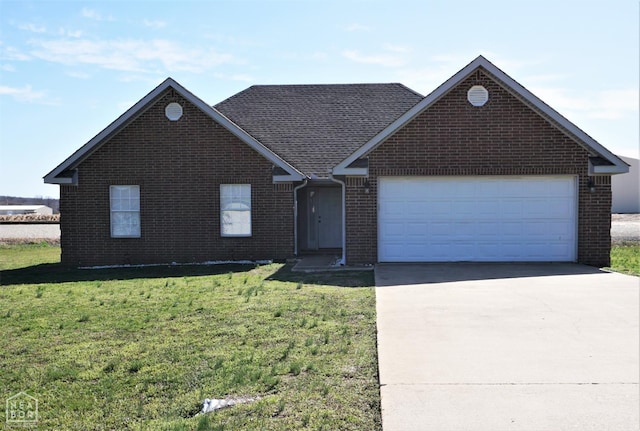 1805 Covey Dr, Jonesboro, AR 72404 - single story home with driveway, a garage, brick siding, and a front yard