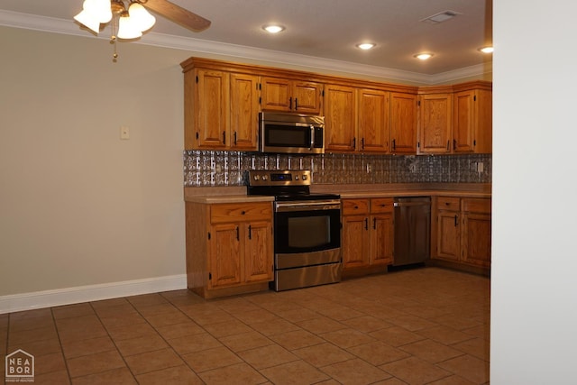 1805 Covey Dr, Jonesboro, AR 72404 - kitchen featuring appliances with stainless steel finishes, ornamental molding, backsplash, brown cabinets, and recessed lighting