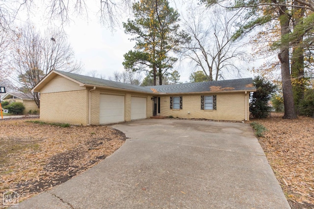 1805 Covey Dr, Jonesboro, AR 72404 - ranch-style home with a garage, brick siding, and concrete driveway