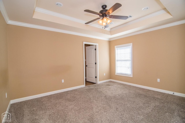 1805 Covey Dr, Jonesboro, AR 72404 - unfurnished room featuring a tray ceiling, carpet floors, a ceiling fan, and ornamental molding