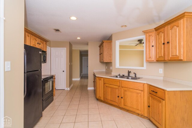 1805 Covey Dr, Jonesboro, AR 72404 - kitchen with black appliances, light tile patterned floors, light countertops, recessed lighting, and ceiling fan